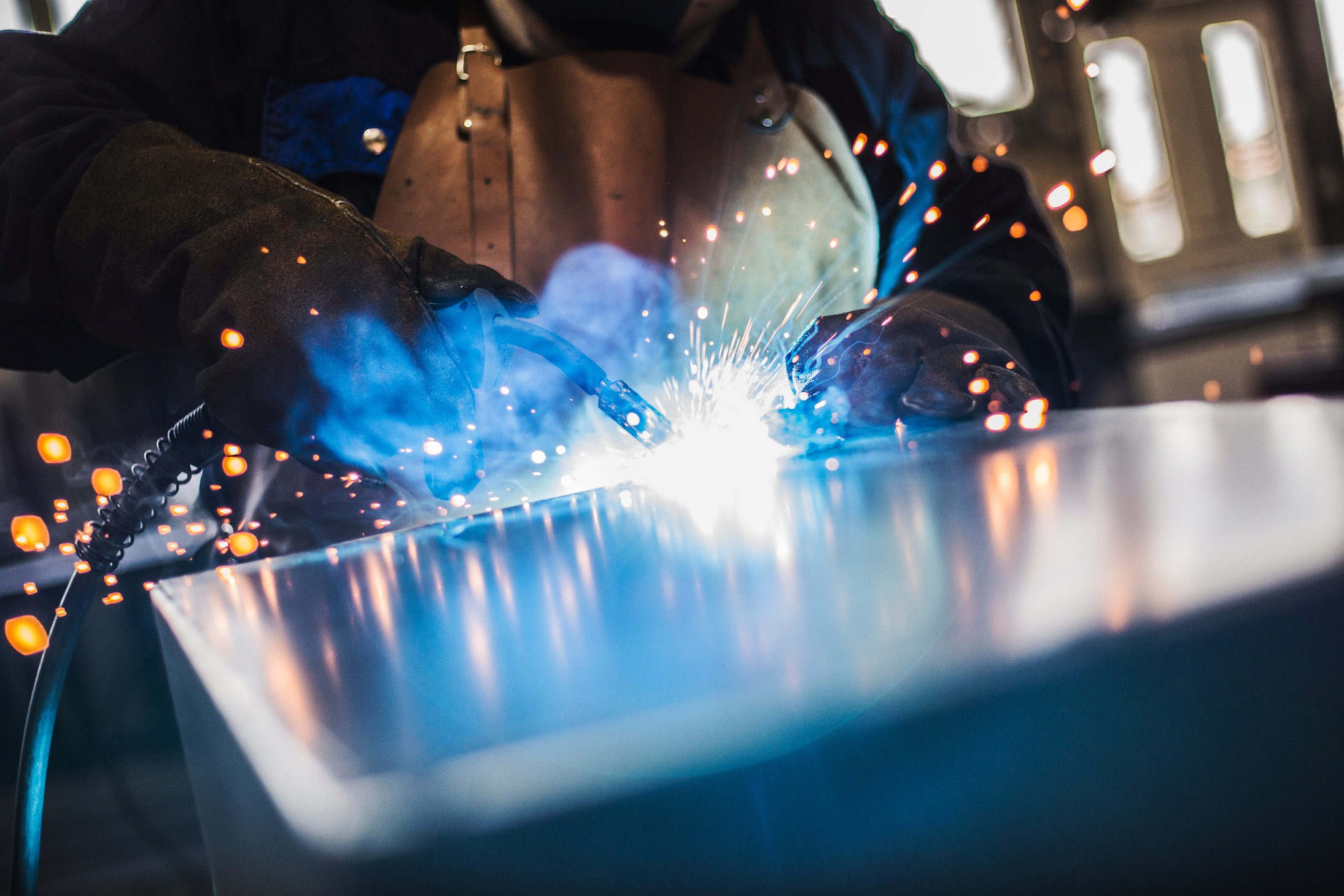 Welder with welding sparks